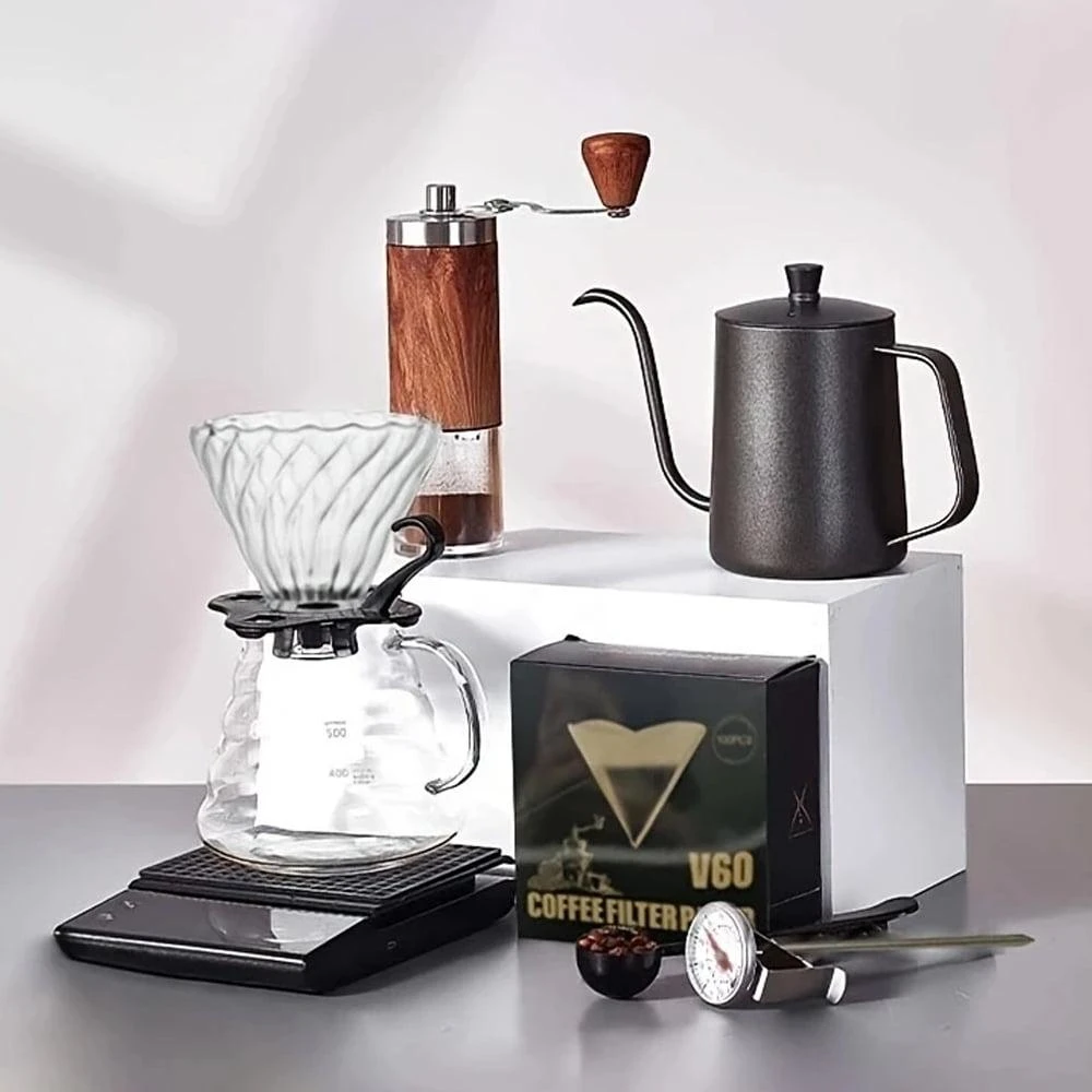 Pour-over coffee setup with grinder, kettle, dripper, and server