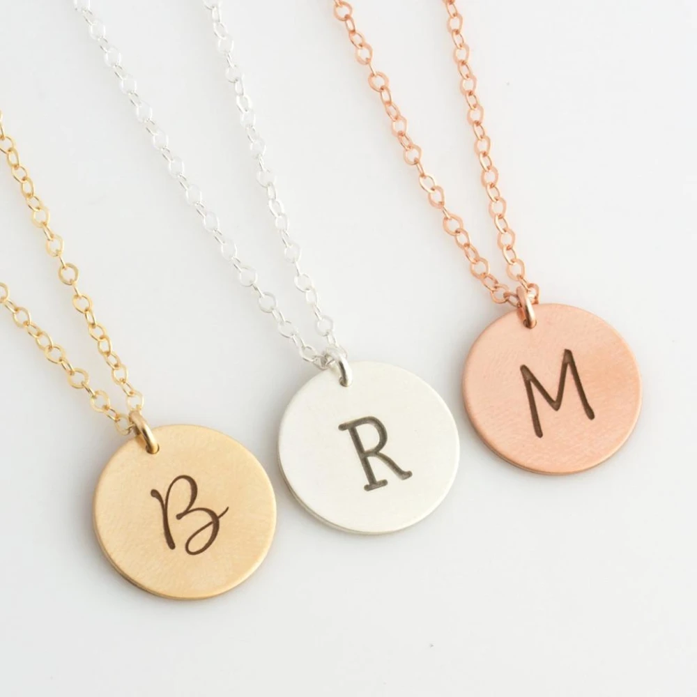 Personalized round initial necklaces in gold, silver, and rose gold